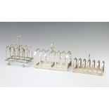 An Edwardian silver 5 bar toast rack London 1910, ditto Sheffield 1932 and 1 other Sheffield 1953,