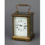A 19th Century French 8 day carriage timepiece with enamelled dial and Roman numerals contained in a