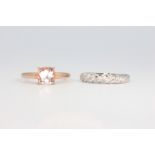 A 9ct yellow gold gem set ring 2 grams, size O and a 9ct white gold wedding band 2.3 grams, size O