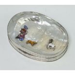 A Continental silver mother of pearl and enamelled oval snuff box decorated with a figure, dog and