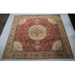 A white and red ground Persian style carpet with central medallion 274cm x 275cm