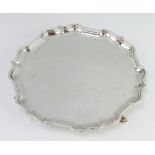 A silver card tray with Chippendale rim on hoof feet, Sheffield 1938, 20cm, 328 grams