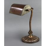 A 1930's copper bank lamp raised on circular base 39cm x 20cm