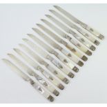 Twelve Continental silver mother of pearl handled dessert knives