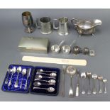 A silver plated sauce boat, cased spoons, cigarette box and other minor plated items