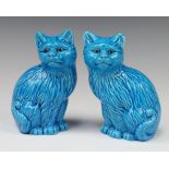 A pair of Continental turquoise glazed figures of seated cats stamped 222, 15cm