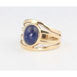 A 9ct yellow gold lapis lazuli open shank ring, size O, 4.9 grams