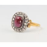 A15ct yellow gold cabochon garnet and diamond ring in the Victorian style 2.8 grams, size O