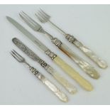 A Victorian silver knife and fork with lily pattern and mother of pearl handles, 3 other knives