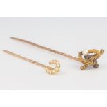 An Edwardian yellow gold pearl set horseshoe tie pin and a rope twist ditto