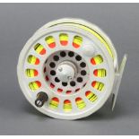 A Wychwood Extremis fly fishing reel with 7/8/9 line weight contained in original pouch