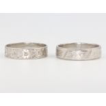 Two platinum wedding bands size L and M, 8.6 grams
