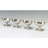 A set of 4 George III silver boat shaped table salts with gilt interiors London 1819, 282 grams