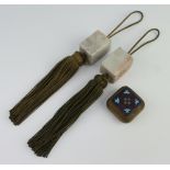 A pair of carved soapstone fobs of rectangular form with silk tassles 4cm together with a rounded