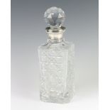 A cut glass spirit decanter with silver collar London 1969, 27cm Minor chips