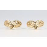 A pair of 9ct yellow gold pierced rings size N 1/2, 4 grams
