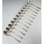 A set of 12 ribbon and bow silver table spoons Birmingham 1909, 1086 grams