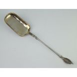 A Danish silver strawberry serving spoon with fancy handle and gilt bowl, the reverse engraved