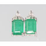 A pair of 14ct white gold rectangular emerald and diamond ear studs, the emeralds approx. 1.66ct,
