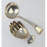 A silver caddy spoon with bright cut decoration Sheffield 1939, another in the form of a hand 27.5