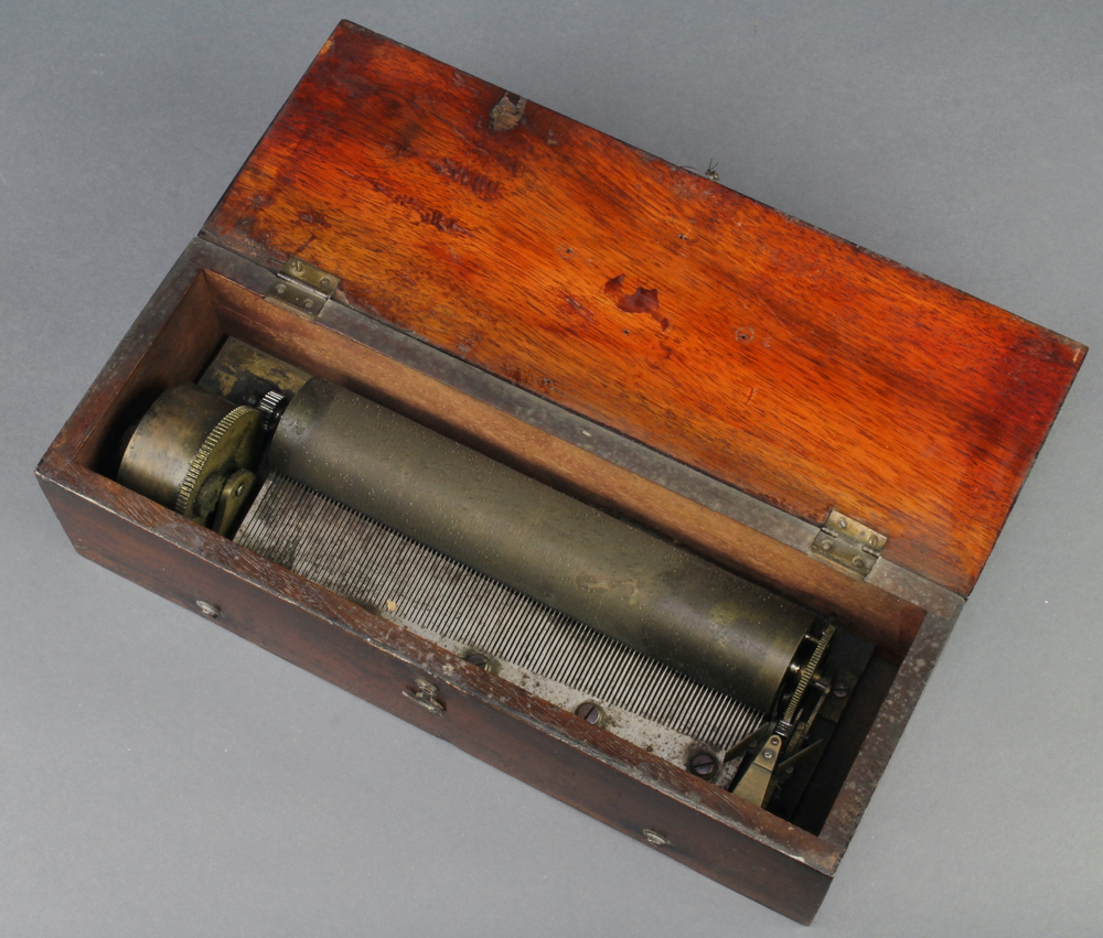 A Victorian cylinder musical box with 19 1/2 cylinder, base plate marked 3007, contained in a