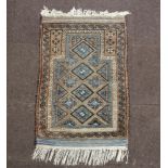 A brown and blue ground Persian prayer rug 110cm x 72cm