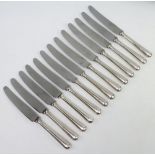 A set of 12 dinner knives with silver handles, Sheffield 1962 and 1 other