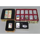 Ten Zippo lighters of American military interest contained in a rectangular metal tin, two 1995