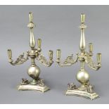 A pair of Victorian ex plated candelabra decorated swans 30cm