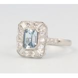 A platinum aquamarine and diamond ring in the Art Deco style, the centre stone approx. 0.75ct, the