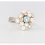 A 14ct white gold pearl and diamond cocktail ring size L 1/2, 6.9 grams