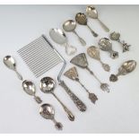 A sterling silver handled sponge cake server and minor plated caddy spoons