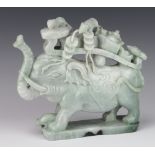 A modern carved hardstone figure of a standing elephant with mice on his back, 22cm This carving