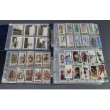 Two ring bound albums of cigarette cards including Wills, Rothmans, Players