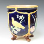 A Minton style Victorian jardiniere, the blue ground decorated with panels of birds and flowers,
