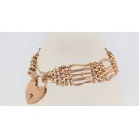 A 9ct yellow gold gate bracelet with padlock clasp 16.5 grams