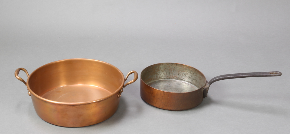 A circular copper saucepan with iron handle marked 26 8cm x 26cm together with a circular copper