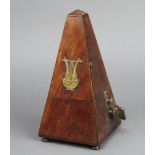 A Maelzel metronome, model Brevete Missing 2 feet and currently not working