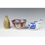 A Japanese slip glazed vase with incised decoration 12cm, an Imari bowl (worn) and a Saki pot