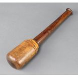 A turned lignum vitae pestle 29cm h x 5cm