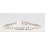 An 18ct white gold brilliant cut diamond line bracelet 6.12ct, 12.4grams, 19cm
