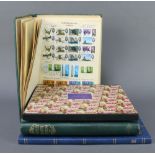 An album of mint and used GB stamps Victoria to Elizabeth II, a stock book of GB stamps QEII, an