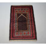 A red and brown ground Belouche rug 140cm x 92cm