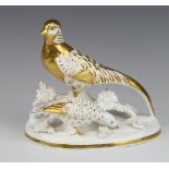 A Crown Staffordshire group of birds with gilt decoration, modelled by J T Jones 16cm There are some