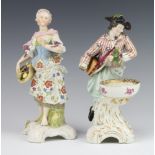 A pair of 19th Century German table salts in the form of a gentleman wearing a satchel raised on a