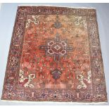 A red and blue ground Caucasian style carpet with central medallion in a multi row border 279cm x