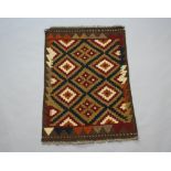 A black and brown ground Maimana Kilim rug with diamond design 97cm x 69cm
