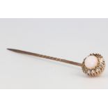 An Edwardian 9ct yellow gold opal and paste tie pin, cased 2.1 grams gross 1 diamond is missing