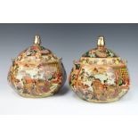 A pair of modern Satsuma hexagonal jars and covers decorated with panels of figures and flowers 21cm