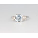 A platinum 3 stone aquamarine and diamond ring, the centre stone approx. 1.8ct, the brilliant cut